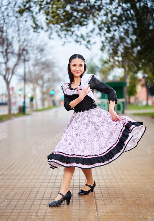 Preview: Chilean woman dressed in traditional Huaso costume dancing cueca or posing