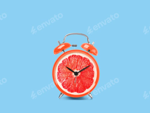 Preview: Juicy grapefruit on alarm clock dial against light blue background. Creative poster