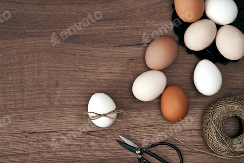 Preview: Directly above shot of natural eggs on the wooden desks