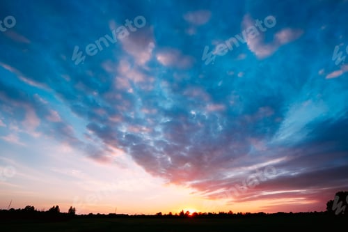 Preview: Sunset, Sunrise Over Rural Field Meadow. Bright Dramatic Sky And