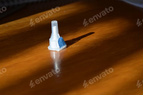 Preview: Closeup shot of insulin needle on wooden background