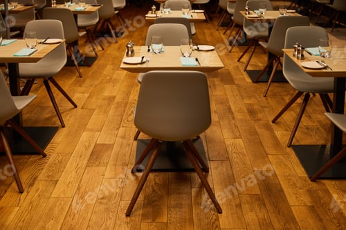 Preview: glasses near plates and napkins on wooden tables