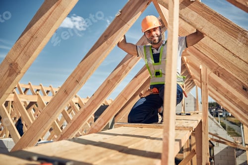 Preview: Positive delighted male person being on the roof