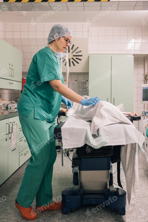 Preview: A healthcare professional wearing blue gloves preparing for a medical procedure