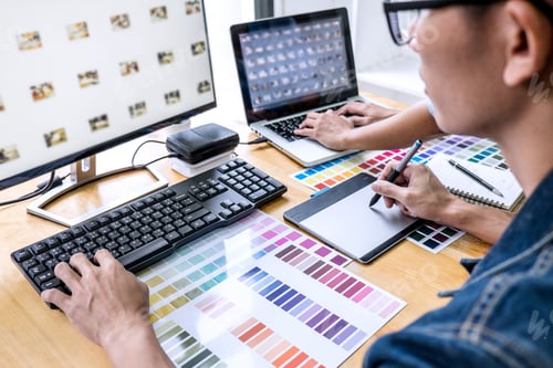 Preview: Young creative team having a meeting in creative office