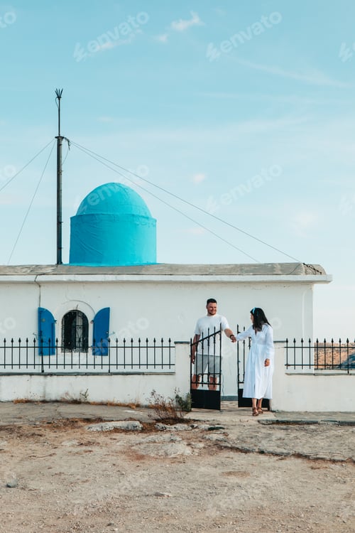 Preview: happy couple travelers in front of Church of the Prophet Elias