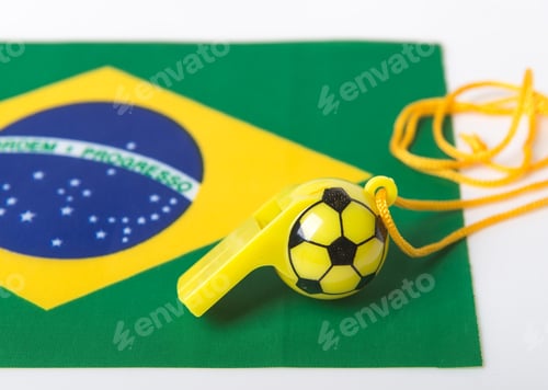Preview: Football Shape Whistle On Brazil Flag Background.