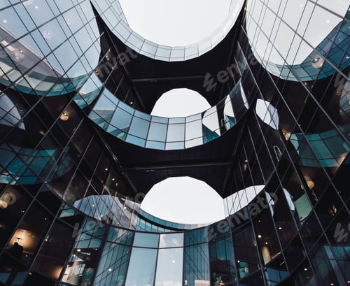 Preview: Low angle shot of modern design of an architectural building with reflections on a glass window