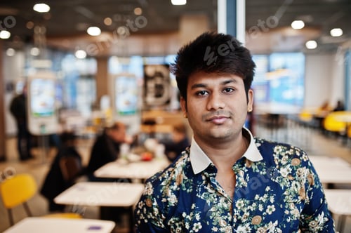 Preview: Indian man at fast food cafe