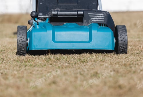 Preview: Scarifying lawn with scarifier, scarifies the lawn and removal of old grass
