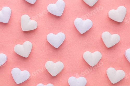 Preview: Composition with candy hearts on pastel blue background.