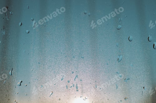 Preview: water droplets running on a double glazed window