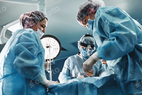 Preview: In the hospital operating room. An international team of professional surgeons and assistants works