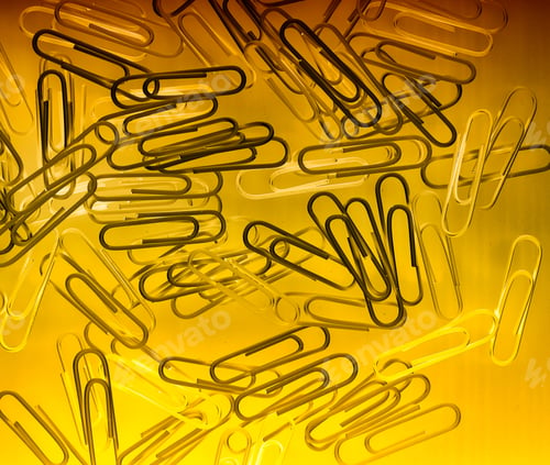 Preview: Paper Clips Office Supplies Lie On A Bright Background