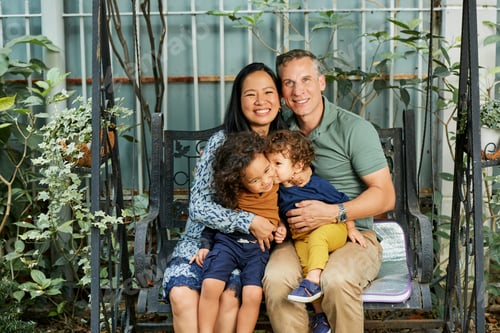 Preview: Happy Family Sitting on Swings