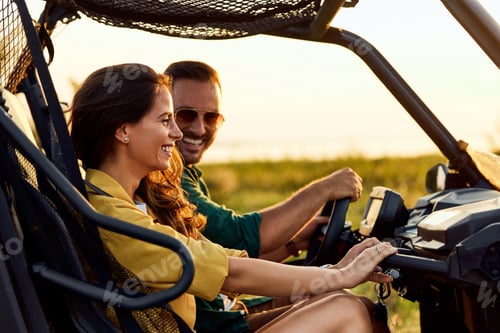 Preview: A cheerful man driving a quad bike and talking with his funny girlfriend.