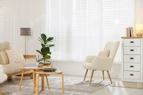 Preview: Stylish living room with lamp, houseplant and sofa. Interior design