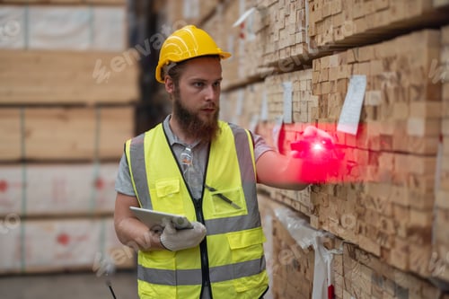 Preview: Warehouse staff verify wooded pallets items using handheld device, ensuring precise shipment.