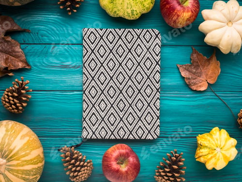 Preview: Notebook on green autumn background