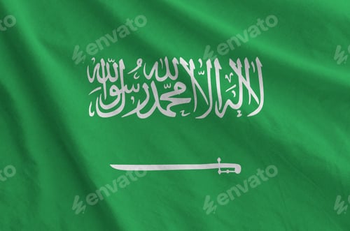 Preview: Saudi Arabia flag depicted on folded wavy fabric of old cloth