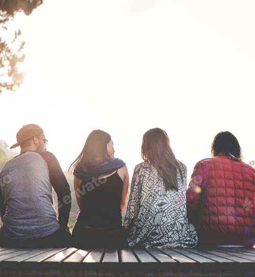 Preview: Friends Sitting in a Row Outdoors Concept