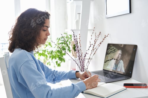 Preview: Hispanic teen school girl student distance learning online lesson on video call.