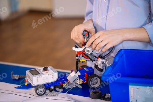 Preview: Busy technical team working on toy