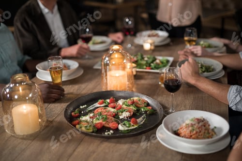 Preview: Friends dining in restaurant