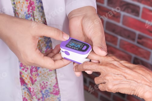 Preview: senior women hand using pulse oximeter