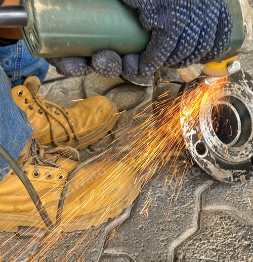 Preview: Sparks fly as a construction worker saws through brick
