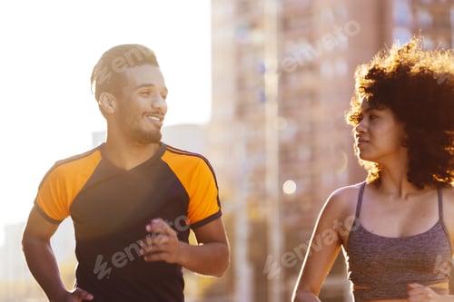 Preview: portrait of a black man running with a latin woman