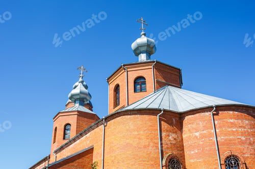 Preview: Dome of Orthodox Christian Church of red brick in summer sunny day