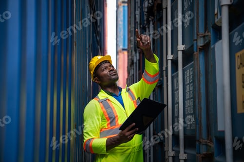 Preview: Male Container yard worker control and checking container.