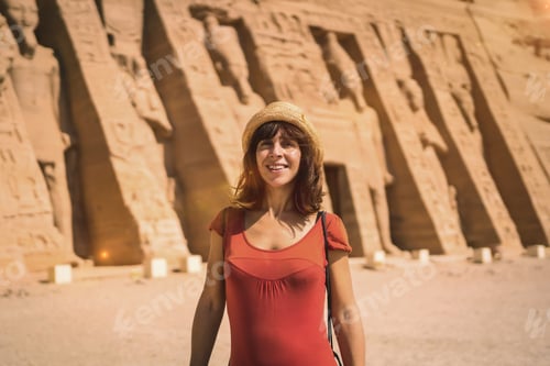 Preview: A young girl in red dress visiting the Egyptian Temple of Nefertari near Abu Simbel