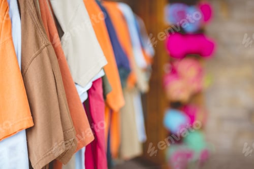 Preview: Closeup shot of different color t-shirts with a blurred background