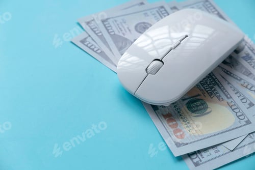 Preview: Concept of Technology, business and finance. Computer mouse over a dollar cash money.