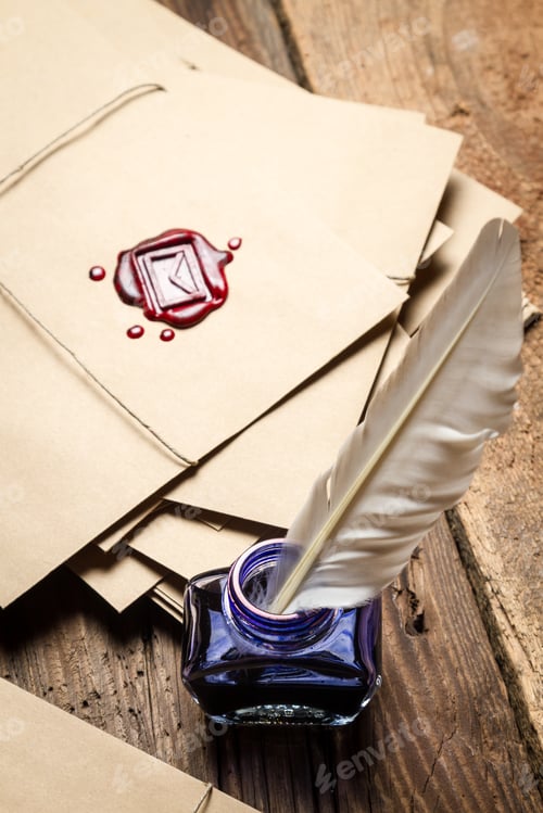 Preview: Closeup of blue inkwell and vintage letters with red sealant