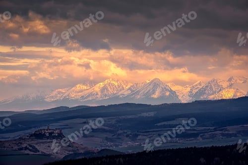 Preview: Mountain range landscape view with Spis castle at sunrise, High Tatras, Slovakia