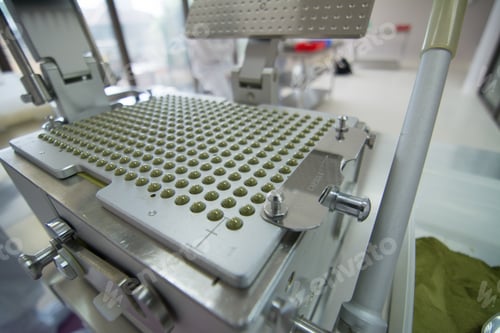 Preview: Closeup shot of medical pills in the production line
