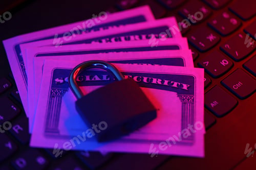 Preview: Padlock and social security card on computer keyboard. Identity theft and identity protection