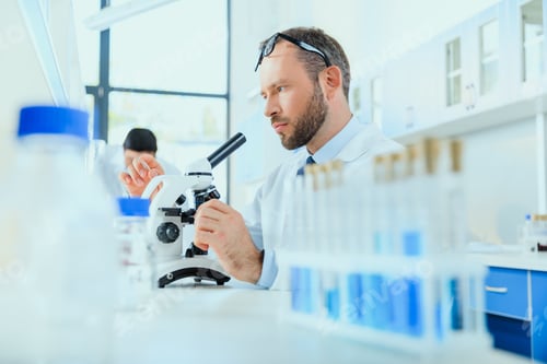 Preview: young doctors in uniform working at testing laboratory, chemical laboratory
