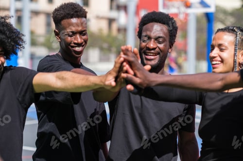 Preview: Group of friends on street court working as a team