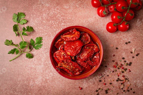 Preview: dried tomatoes, in a bowl, top view, on a brown background,