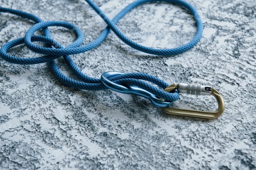 Preview: This is for protection. Knot with metal carabiner. Silver colored device for the active sports