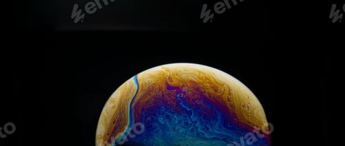 Preview: Half a soap bubble. Close-up. Black background. Bright colors. Side view. Imitation of an unknown pl