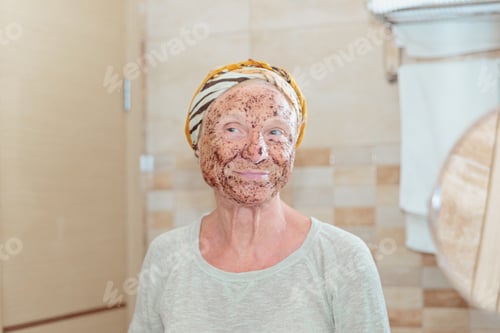 Preview: Senior woman taking care of her face