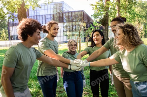 Preview: Portrait of multiethnic group of volunteers with garbage bags cleaning city park.