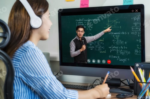 Preview: Rear View of Asian student learning with teacher over the physics formular in thai laguage