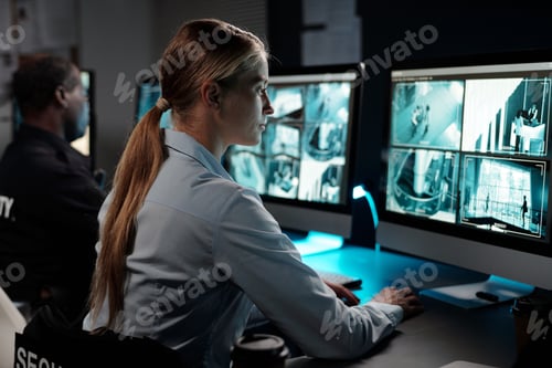 Preview: Woman observing cctv video camera