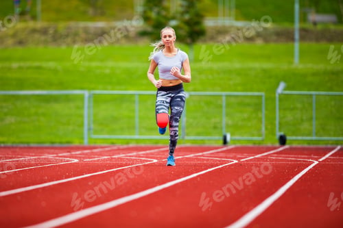 Preview: Young Female In Sportswear Running On Sports Tracks